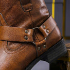 Men's ankle boots with cross-over buckled straps, metal studs and low heel