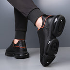 Black men's slip-on athletic trainers with chunky sculpted soles