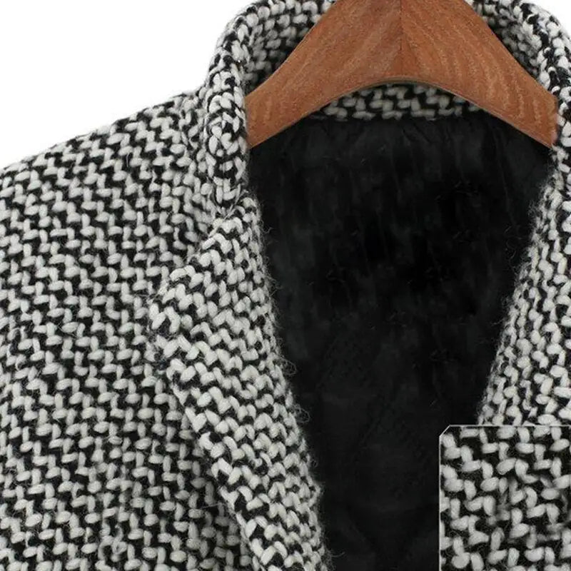 Women's long black and white herringbone coat with notched collar and button fastening