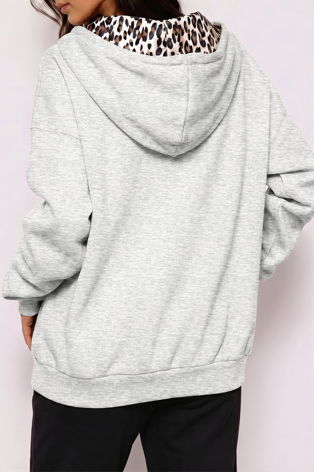 Women's oversized zip hoodie with leopard-print lined hood and front pockets