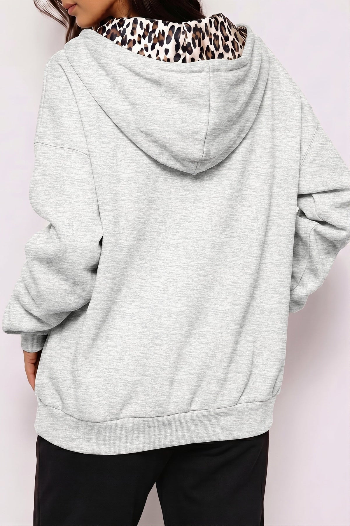 Women's oversized zip hoodie with leopard-print lined hood and front pockets