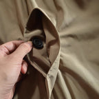 Men's button-front coat with point collar, long sleeves and side pockets