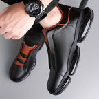 Black men's slip-on athletic trainers with chunky sculpted soles