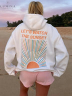 Women's pullover hoodie with hood and sunset graphic print on the back