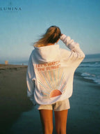 Women's pullover hoodie with hood and sunset graphic print on the back