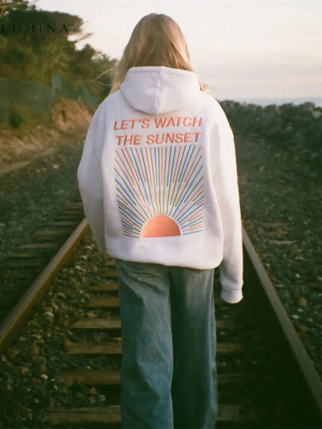 Women's pullover hoodie with hood and sunset graphic print on the back