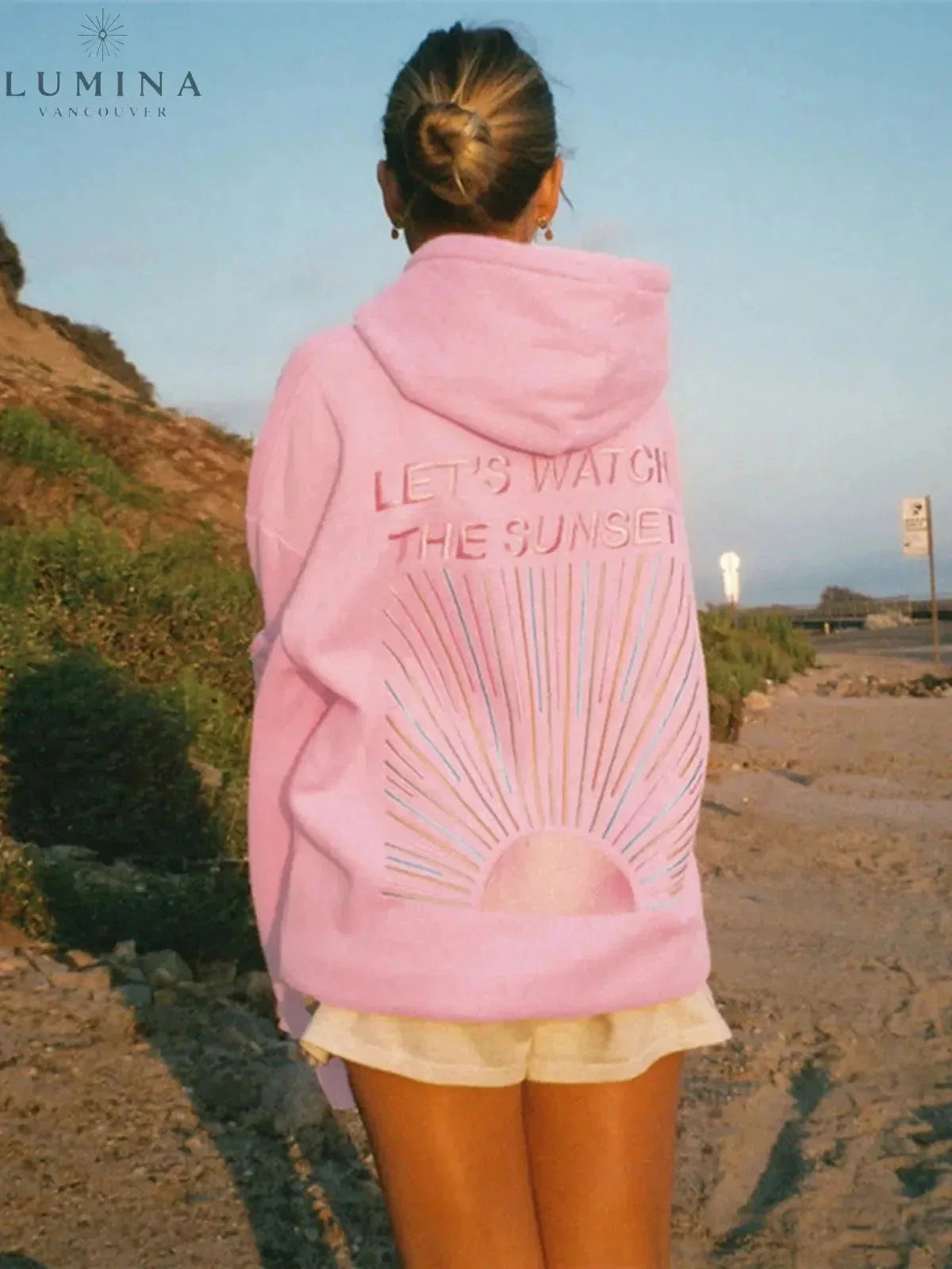 Women's pullover hoodie with hood and sunset graphic print on the back