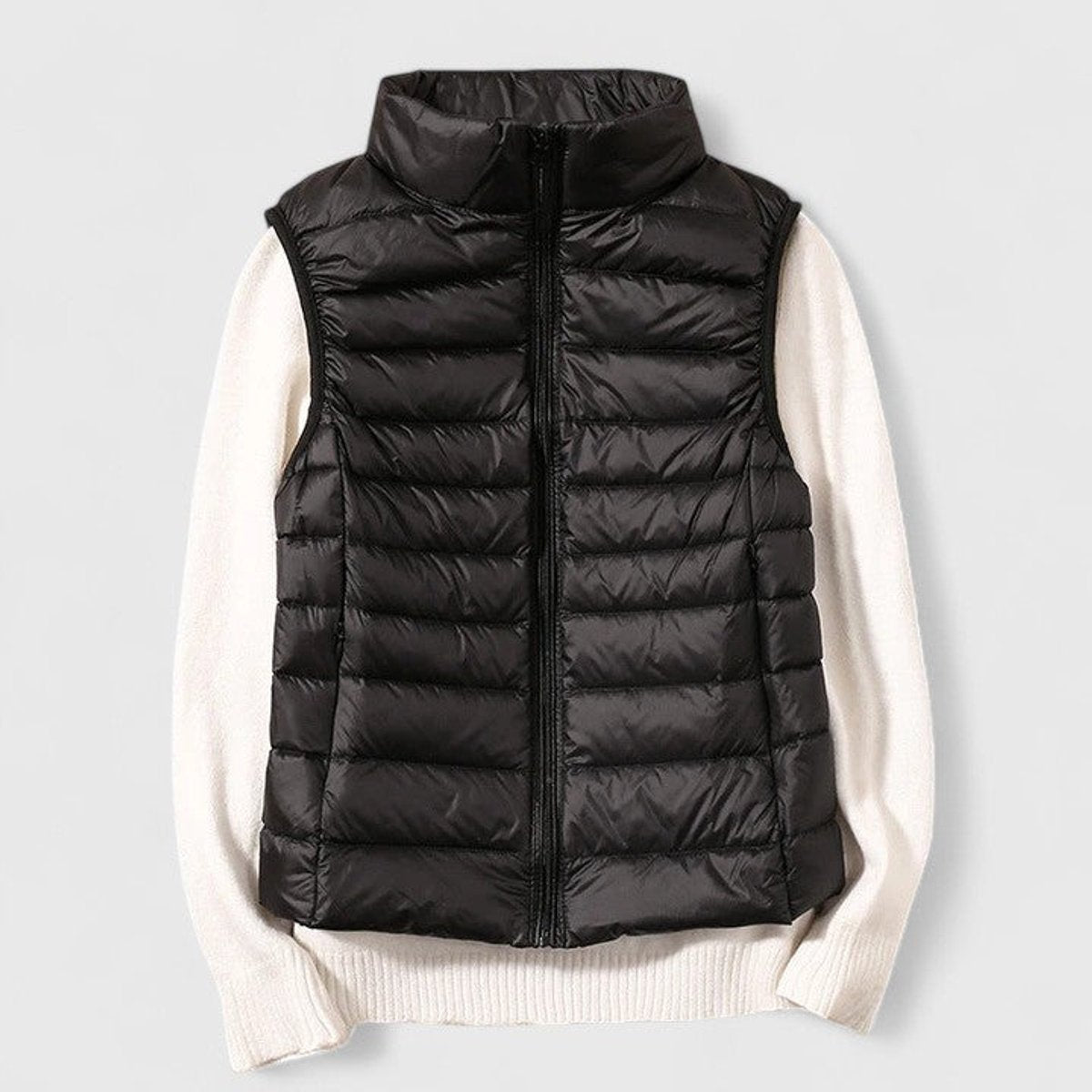 Women's sleeveless quilted puffer gilet with high collar and zip front