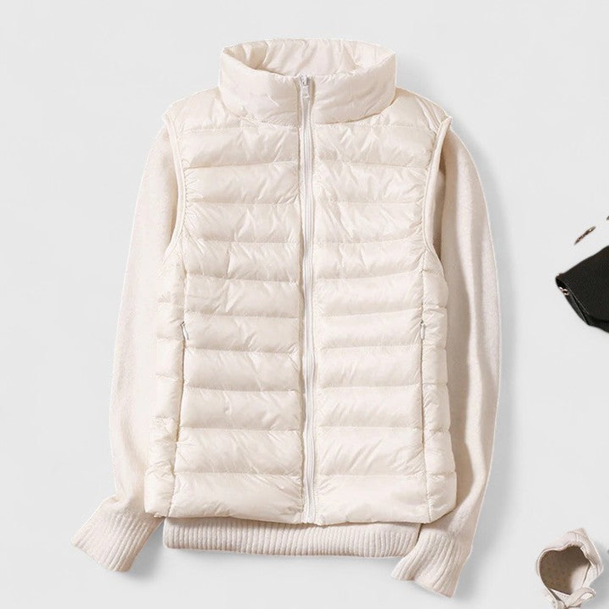 Women's sleeveless quilted puffer gilet with high collar and zip front