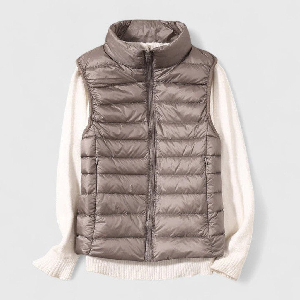 Women's sleeveless quilted puffer gilet with high collar and zip front