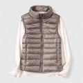 Women's sleeveless quilted puffer gilet with high collar and zip front