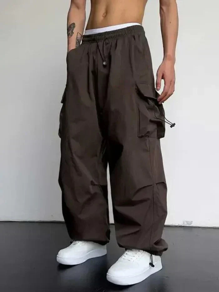 Men's wide cargo trousers with drawstring waist and multiple pockets