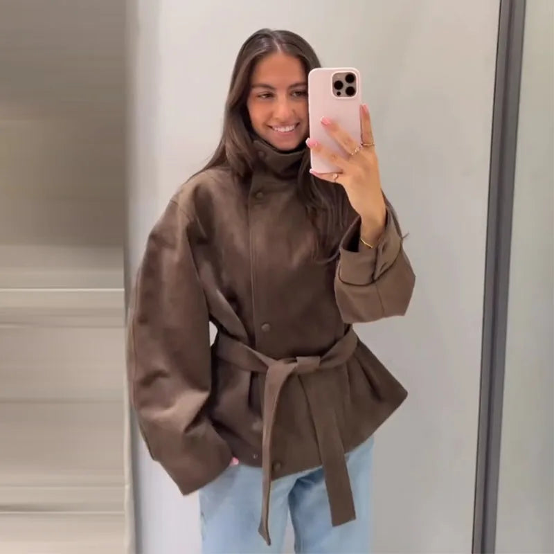 Women's brown belted jacket with high collar, long sleeves and button cuffs