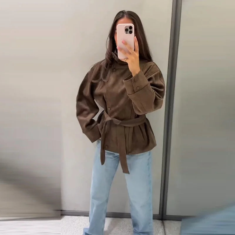 Women's brown belted jacket with high collar, long sleeves and button cuffs