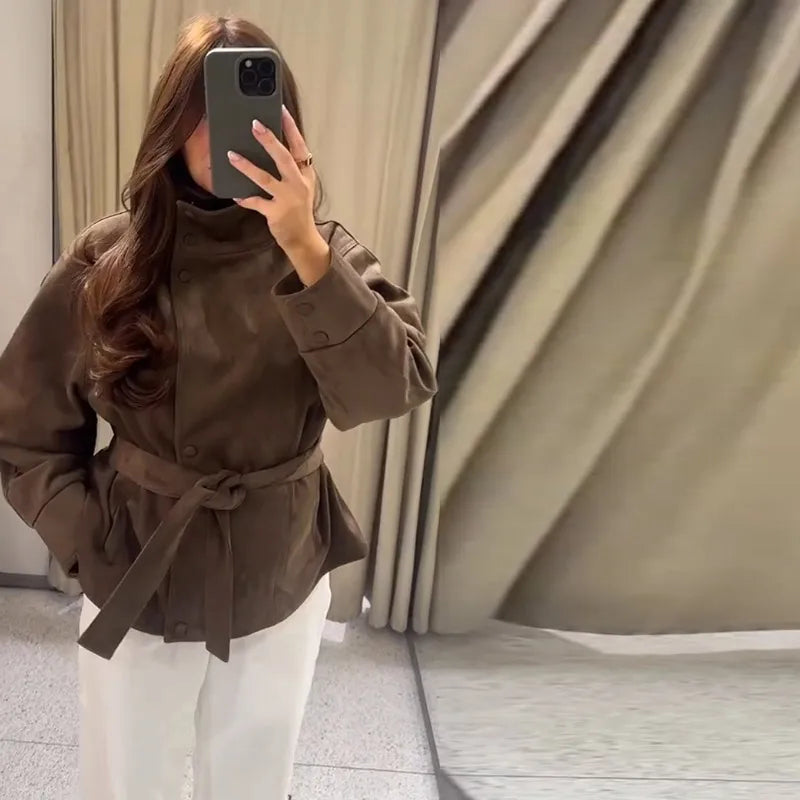 Women's brown belted jacket with high collar, long sleeves and button cuffs