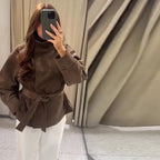 Women's brown belted jacket with high collar, long sleeves and button cuffs