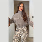 Women's grey cropped bomber jacket with mock neck and flap pockets