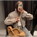 Women's grey cropped bomber jacket with mock neck and flap pockets
