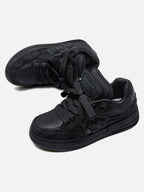 Black high-top skate sneakers with tonal camouflage side panels and lace-up fronts