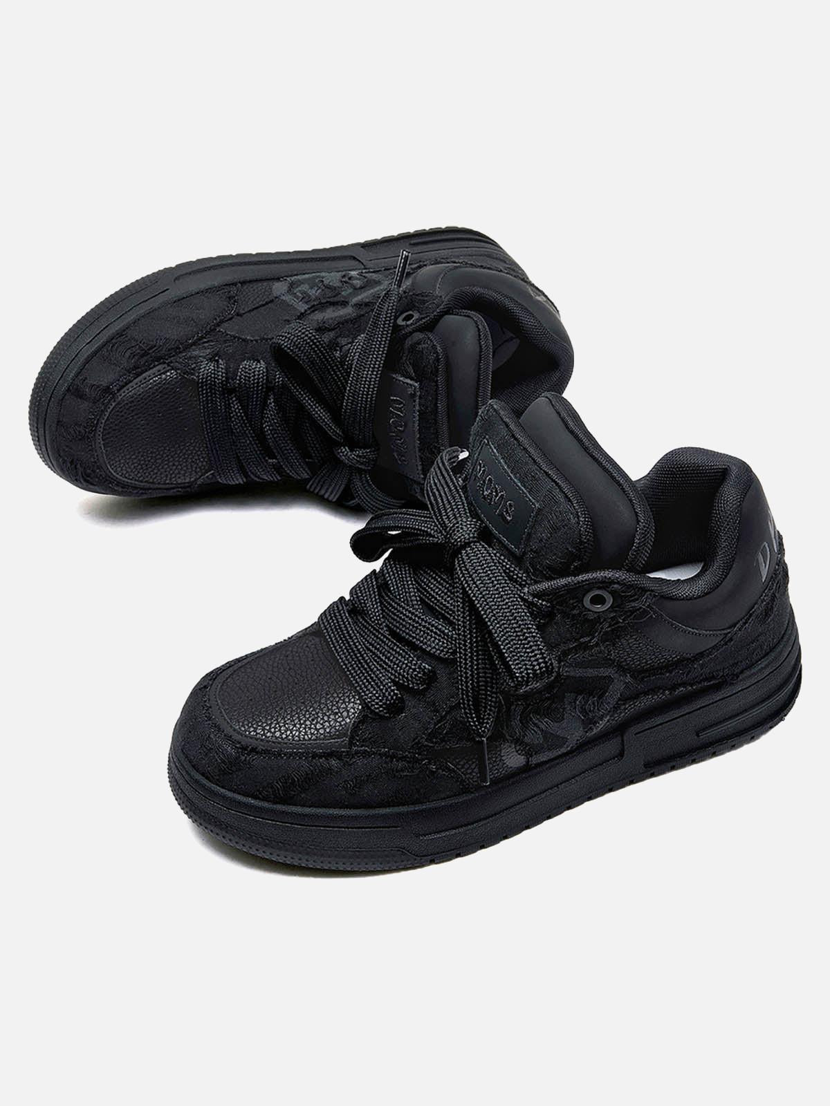 Black high-top skate sneakers with tonal camouflage side panels and lace-up fronts