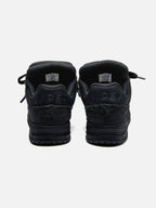 Black high-top skate sneakers with tonal camouflage side panels and lace-up fronts