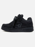 Black high-top skate sneakers with tonal camouflage side panels and lace-up fronts