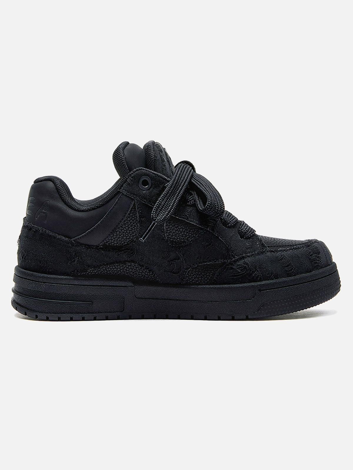 Black high-top skate sneakers with tonal camouflage side panels and lace-up fronts