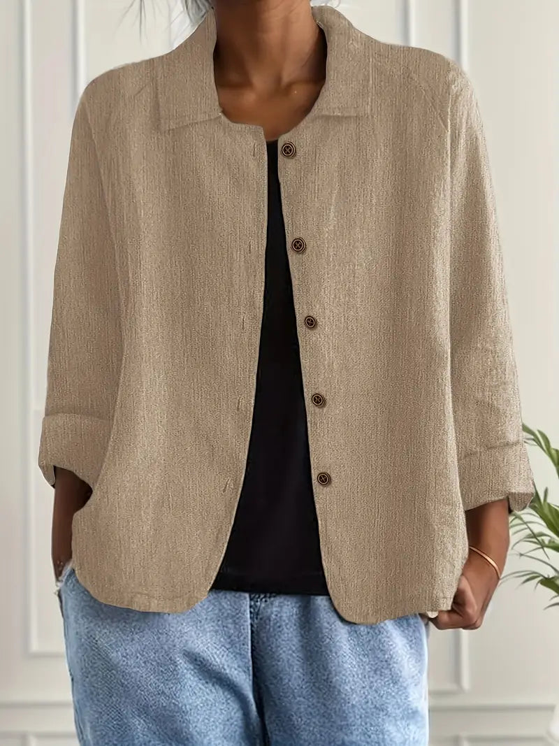 Women's button-front collared cardigan with long sleeves and rounded hem