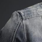 Men's blue denim jacket with mandarin collar, long sleeves and multiple zipped pockets