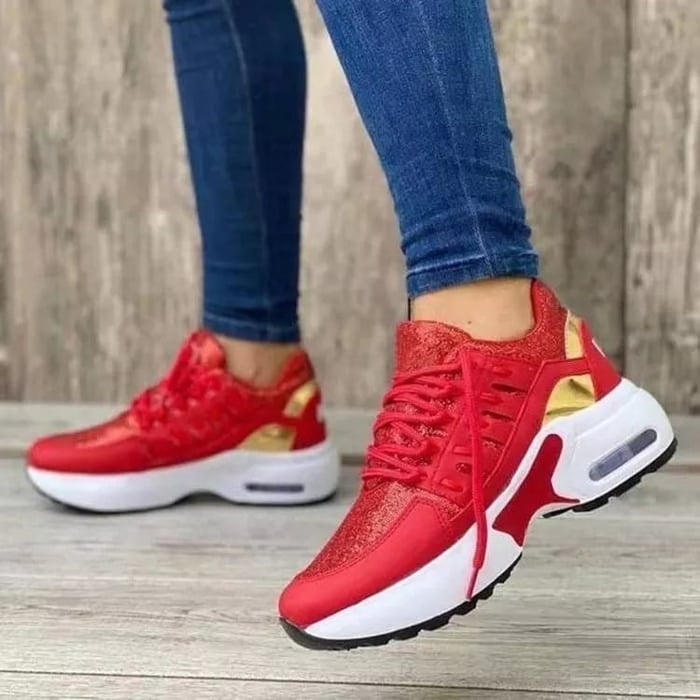 Women's low-top lace-up trainers with textured panels and chunky soles
