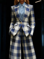 Women's blue checked blazer with notched collar, long sleeves and flap pockets