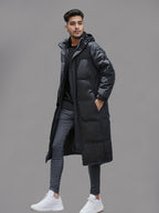 Men's black long hooded puffer coat with quilted panels and front pockets