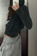 Women's black fitted cropped hoodie with hood, front zip and silver-tone stud detailing