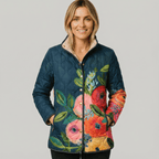 Women's navy quilted jacket with colourful floral pattern and stand collar