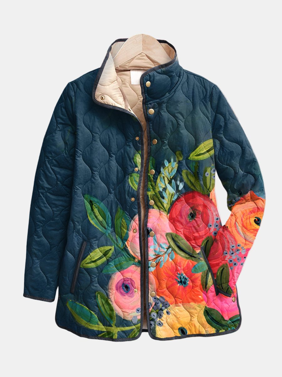 Women's navy quilted jacket with colourful floral pattern and stand collar