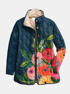 Women's navy quilted jacket with colourful floral pattern and stand collar