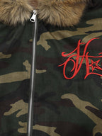 Green camouflage hooded jacket with tan fur-effect trim and red embroidery