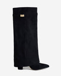 Women's black knee-high boots with pointed toes, low heels and buckle strap details