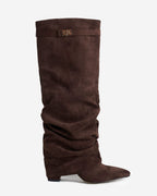 Women's brown slouchy knee-high boots with pointed toes, low heels and buckle straps
