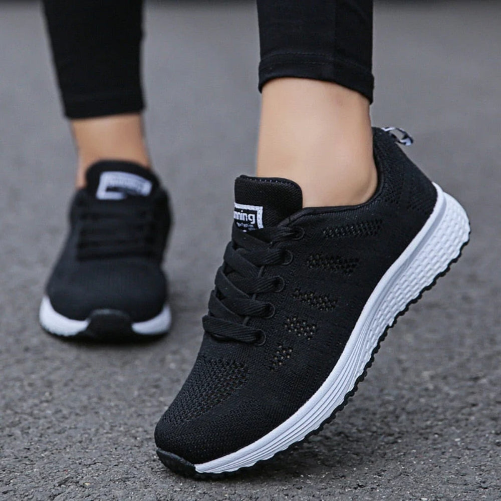 Women's lace-up trainers with a textured upper and layered sole