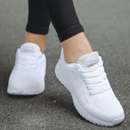 Women's lace-up trainers with a textured upper and layered sole