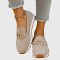 Women's textured loafers with rounded toes and front buckle details