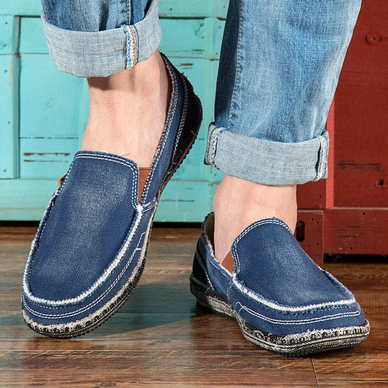 Casual slip-on loafers with rounded toes, stitched uppers and flat textured soles