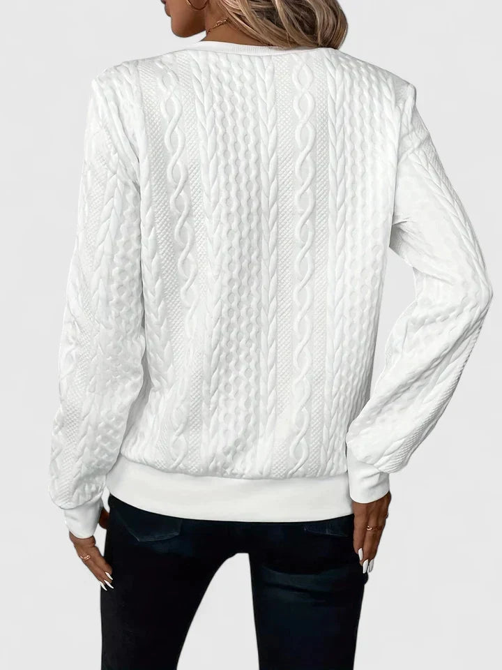 Women's textured cable knit quarter-zip sweater with long sleeves and ribbed trims
