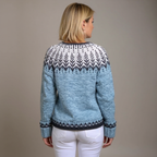 Women's blue cardigan with contrasting geometric pattern and button front