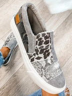 Women's patterned slip-on loafers with animal-print panels and flat white soles
