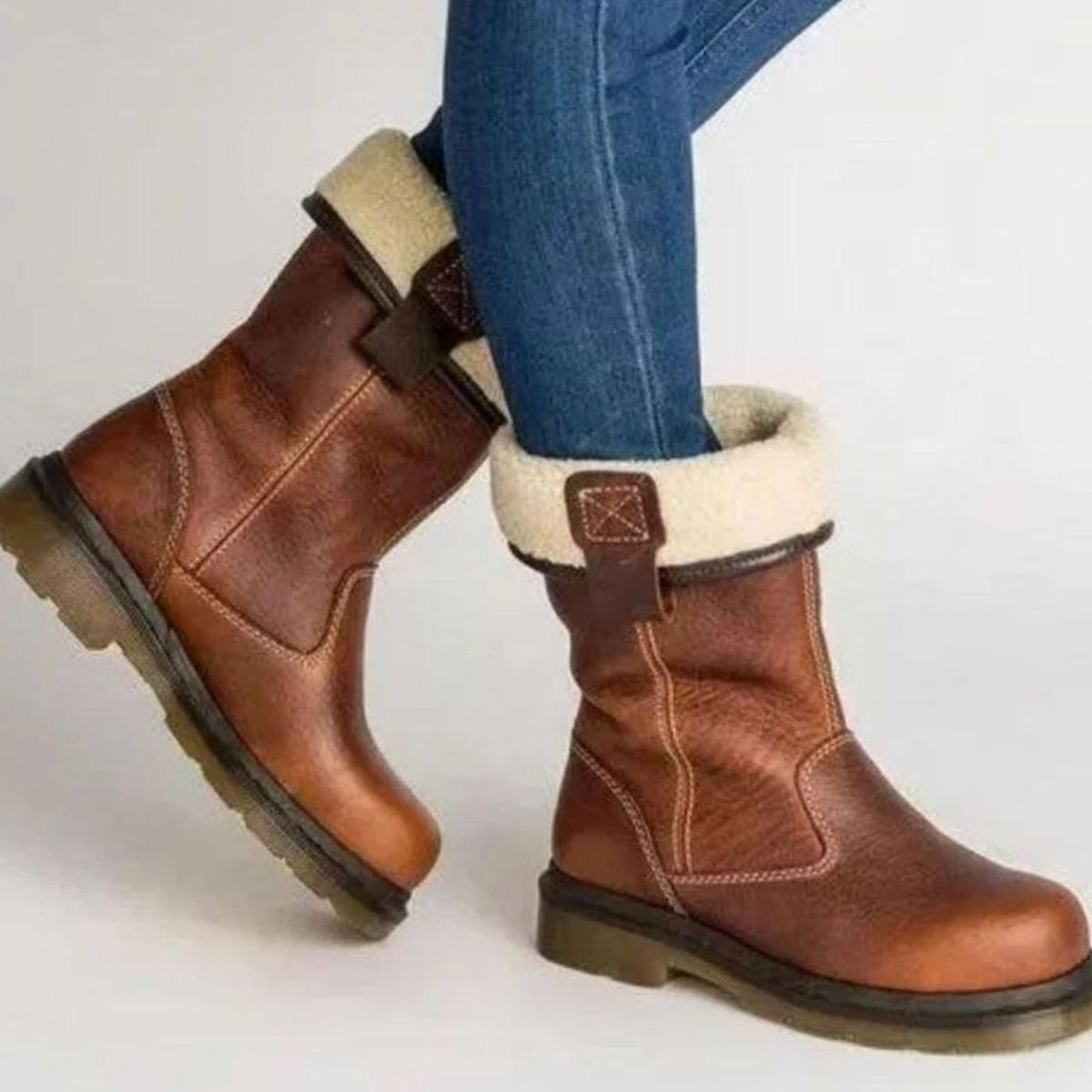Women's brown mid-calf winter boots with cream fleece-style cuffs and low heels