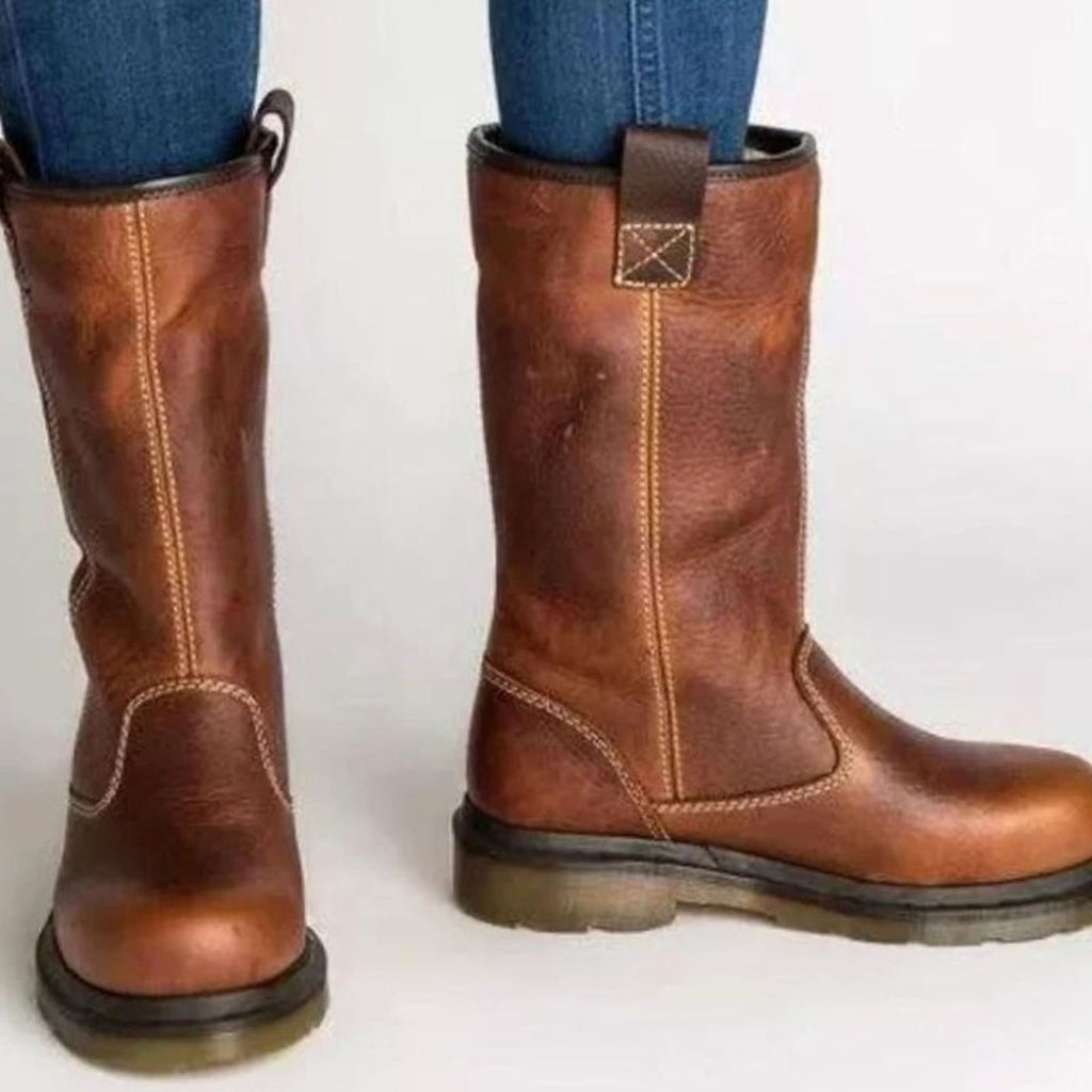 Women's brown mid-calf winter boots with cream fleece-style cuffs and low heels