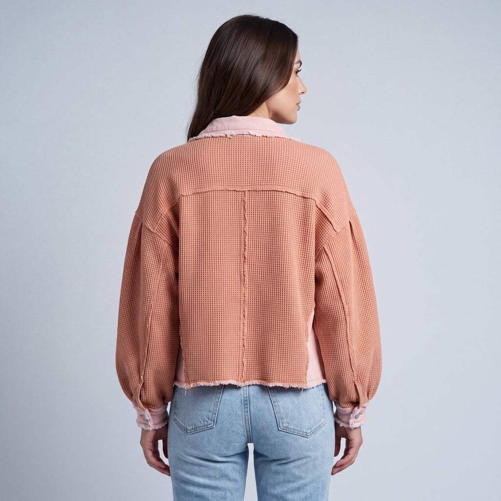 Women's cropped utility jacket with long sleeves, chest pockets and frayed trims