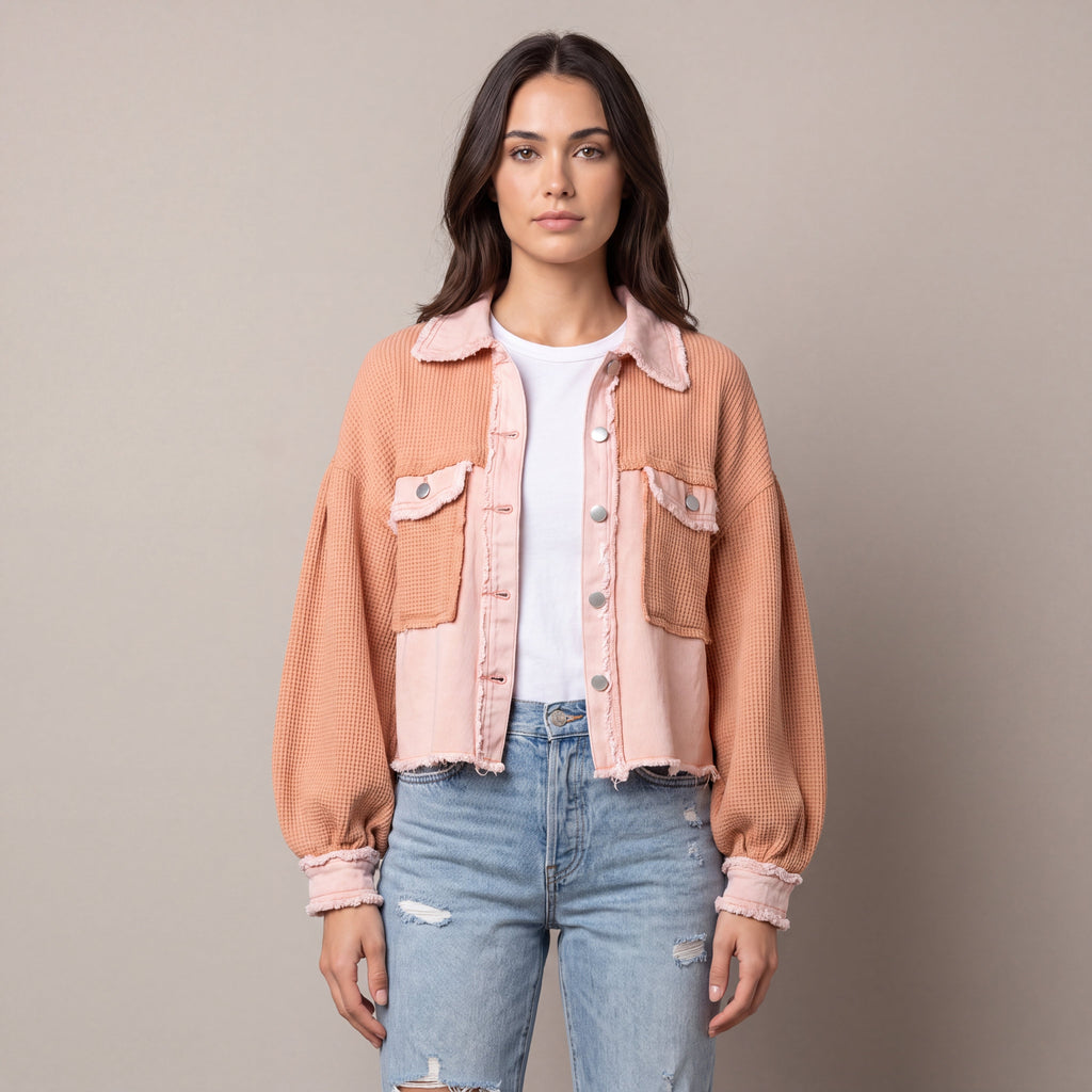 Women's cropped utility jacket with long sleeves, chest pockets and frayed trims